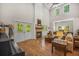 Bright living room with hardwood floors, fireplace, and double doors to the outdoor space at 32 Middleton Oaks Rd, Charleston, SC 29414