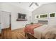 Comfortable main bedroom with vaulted ceiling, hardwood flooring, and stylish decor at 32 Middleton Oaks Rd, Charleston, SC 29414
