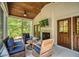 Relaxing screened porch featuring a fireplace, comfortable seating, and serene views at 32 Middleton Oaks Rd, Charleston, SC 29414