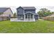 Spacious backyard with white railed deck and covered patio at 321 Houston Dr, Ladson, SC 29456