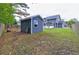View of the backyard with an outbuilding or shed, offering extra storage space at 321 Houston Dr, Ladson, SC 29456
