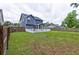 Spacious backyard with a large white fenced deck, and lush green grass, perfect for outdoor entertaining at 321 Houston Dr, Ladson, SC 29456