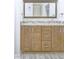 Bathroom vanity with granite countertops, double sinks, and stylish wood cabinets at 321 Houston Dr, Ladson, SC 29456