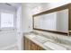 Bathroom featuring double sinks, granite countertop, window and tile flooring at 321 Houston Dr, Ladson, SC 29456