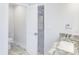 Bathroom with wood look tile, marble countertop, and open doorway to main bedroom at 321 Houston Dr, Ladson, SC 29456