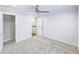 Bedroom with neutral walls, carpet flooring, walk-in closet and a ceiling fan at 321 Houston Dr, Ladson, SC 29456