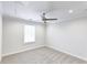 This bedroom features neutral walls, carpet flooring, a window and a ceiling fan at 321 Houston Dr, Ladson, SC 29456