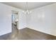 Bright dining room featuring hardwood floors, a modern chandelier, and easy access to other rooms at 321 Houston Dr, Ladson, SC 29456