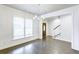 Elegant dining room with hardwood floors, natural light, and seamless flow to the entryway at 321 Houston Dr, Ladson, SC 29456