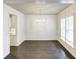 Open-concept dining room with hardwood floors, modern chandelier, and access to the kitchen at 321 Houston Dr, Ladson, SC 29456