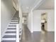 Spacious foyer with hardwood floors, a staircase, and access to the kitchen and living areas at 321 Houston Dr, Ladson, SC 29456