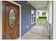 Charming front porch with a beautiful wooden front door and ample space to relax at 321 Houston Dr, Ladson, SC 29456