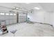 Spacious two-car garage with modern doors, overhead storage, and ample space for vehicles and storage at 321 Houston Dr, Ladson, SC 29456