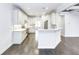 Open kitchen featuring white cabinets, stainless appliances, island seating and clear view to the living area at 321 Houston Dr, Ladson, SC 29456