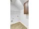 Simple laundry room with tile floors, a wire shelf, hookups, and brown storage cabinet at 321 Houston Dr, Ladson, SC 29456