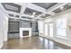 Spacious living room featuring a coffered ceiling, fireplace with built-ins, and a doorway to the back yard at 321 Houston Dr, Ladson, SC 29456