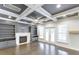 Bright living room showcases beautiful coffered ceilings, a fireplace, built-in shelving, and lots of natural light at 321 Houston Dr, Ladson, SC 29456