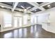 Open living room with grey trim ceiling, fan, recessed lights, windows and view to the outdoor patio and kitchen area at 321 Houston Dr, Ladson, SC 29456