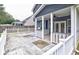 Covered patio with ceiling fan, grilling area and decorative concrete flooring at 321 Houston Dr, Ladson, SC 29456