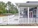 Rear view of the covered patio, perfect for enjoying the backyard and outdoor living at 321 Houston Dr, Ladson, SC 29456
