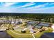 An aerial view of tennis courts, a pool, and manicured grounds provides resort style living at 331 Fish Creek Ct, Summerville, SC 29486