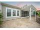 An exterior view of the backyard patio featuring a pergola, brick retaining wall, and screened-in porch at 331 Fish Creek Ct, Summerville, SC 29486