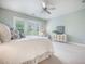 Bedroom has a fan, natural light from three windows, and a lovely white cabinet at 331 Fish Creek Ct, Summerville, SC 29486