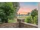 Picturesque community view with a serene pond, lush landscaping, and well-maintained properties at 331 Fish Creek Ct, Summerville, SC 29486