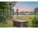 A community view with a pond, manicured green spaces, and beautiful landscaping at 331 Fish Creek Ct, Summerville, SC 29486