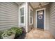 Close-up of the home's front entrance with a welcoming wreath and tiled porch at 331 Fish Creek Ct, Summerville, SC 29486