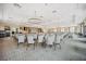 A large event space has elegant lighting, a stage, and many chairs in the room at 331 Fish Creek Ct, Summerville, SC 29486