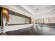 A wide view of a large event space with a stage, hardwood floor, and brick accent wall at 331 Fish Creek Ct, Summerville, SC 29486