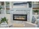 A close-up of a modern fireplace framed by stylish decor and shelving at 331 Fish Creek Ct, Summerville, SC 29486