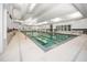 Inviting indoor pool with lap lanes, large windows, access ladder and relaxing atmosphere at 331 Fish Creek Ct, Summerville, SC 29486