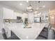 Spacious kitchen island with stainless steel appliances, white cabinetry and pendant lighting at 331 Fish Creek Ct, Summerville, SC 29486
