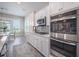 Modern kitchen featuring stainless steel appliances, white cabinets, and lots of natural light at 331 Fish Creek Ct, Summerville, SC 29486