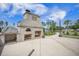 Patio featuring a brick fireplace with a grill, situated within a beautifully landscaped backyard at 331 Fish Creek Ct, Summerville, SC 29486