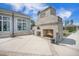 Outdoor fireplace with grill and wood storage area, perfect for entertaining in the backyard at 331 Fish Creek Ct, Summerville, SC 29486