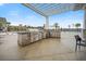 Outdoor kitchen with stainless steel appliances, grill, and counter space near the pool at 331 Fish Creek Ct, Summerville, SC 29486