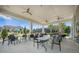 Inviting outdoor seating area with fans offering a comfortable space for dining and socializing with great views at 331 Fish Creek Ct, Summerville, SC 29486