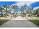 A community view with palm trees, manicured grass and walkways with outside seating to relax and enjoy the view at 331 Fish Creek Ct, Summerville, SC 29486