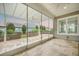 Relaxing screened porch featuring travertine flooring, a pergola, and views of the landscaped backyard and neighboring homes at 331 Fish Creek Ct, Summerville, SC 29486