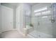 Modern tiled shower with glass door and a built-in bench for added convenience at 331 Fish Creek Ct, Summerville, SC 29486