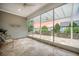 Bright sunroom with travertine floors and screened windows opening up to a patio at 331 Fish Creek Ct, Summerville, SC 29486