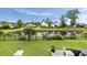 Serene backyard view of pond with black fence and lush landscaping at 3726 Orion Ln, Mount Pleasant, SC 29466