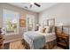 Cozy bedroom features two windows with plantation shutters and a comfortable bed with decorative pillows at 3726 Orion Ln, Mount Pleasant, SC 29466