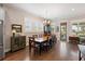 Elegant dining room with hardwood floors, plantation shutters, and a traditional dining set at 3726 Orion Ln, Mount Pleasant, SC 29466
