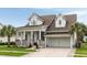 Charming two-story home with a well-manicured lawn and a two-car garage at 3726 Orion Ln, Mount Pleasant, SC 29466