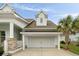 Detached two-car garage features a charming dormer and is accented by a palm tree at 3726 Orion Ln, Mount Pleasant, SC 29466
