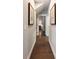 Inviting hallway featuring hardwood floors and decorative artwork at 3726 Orion Ln, Mount Pleasant, SC 29466